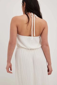 Pleated Flowy Midi Dress Offwhite | NA-KD Chic Halter Neck Top For Brunch, Feminine Backless Midi Dress With Tie Back, Halter Neck Dress With Gathered Neckline For Date Night, Chic Halter Neck Maxi Dress With Elastic Neckline, Chic Backless Halter Dress, Chic Backless Halter Dress For Casual Wear, Chic Backless Halter Dress For Casual Occasions, Chic Backless Halter Dress For Casual Events, Chic White Halter Dress With Tie Back