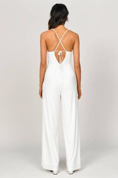 Get Ready For That All Nighter In The Late Night Wide Leg White Jumpsuit. This Flowy Jumpsuit Features A Wide Leg, A Deep V Neck, And A Criss Cross Open Back, Perfect For Warm Summer Nights. This Strappy Jumpsuit Looks Great With Some Heels Or Pointed Boots! White Wide Leg Jumpsuit, Strappy Jumpsuit, Flowy Jumpsuit, Pointed Boots, All Nighter, Strapless Jumpsuit, White Jumpsuit, Denim Jumpsuit, Wide Leg Jumpsuit