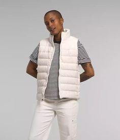 This stylish white puffer vest by The North Face is the perfect addition to any wardrobe. With a full zip closure and insulated fabric type, this vest is ideal for cooler weather in the winter, fall, and spring seasons. The vest features pockets and accents like buttons, zippers, and an embroidered logo, making it both functional and fashionable. The polyester outer shell material and lining material help ensure that the vest is machine washable, making it easy to care for. In a size extra small, this vest is a great choice for women who want to stay warm and comfortable without sacrificing style. Perfect for casual occasions, this vest is sure to become a favorite. Down Vest Outfit Womens, Women's Vests, White Puffer Vest, Vest Outfit, Womens Puffer Vest, Vest White, Down Vest, North Face Women, We Wear