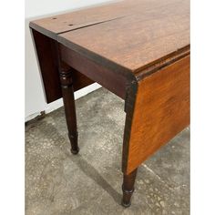 an old wooden desk with one drawer open