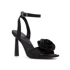 Black Heels With Flowers, Glamorous Spring Sandals With 4-inch Heel, Black Flower Heels, Summer Event Heels With Ankle Strap, Spring Sandals With 4-inch Heel And Single Toe Strap, Spring Cocktail Heels With Ankle Strap, Elegant Ankle Strap Heels For Summer, Elegant Open Toe Heels For Spring, Synthetic Summer Heels With Flower Design