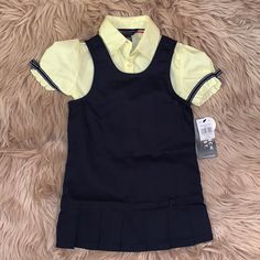 Navy Blue Dress. Super Cute As A Uniform. Size 4. Brand New. Zipper Back. Fitted Short Sleeve Dress For School, Yellow School Dress For Spring, Yellow Fitted School Top, Yellow Fitted Tops For School, Yellow Spring Dresses For School, Fitted Short Sleeve School Uniform Dresses, French Toast Uniforms, French Toast School Uniforms, School Uniform Dress