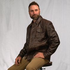 Inspired by the old west ranchers who made their mark at the base of the Bighorns… the Sheridan Barn Coat delivers enduring quality worthy of the pioneers of the past, tailored with a modern fit for the present. Outfitted with 100% full-grain lambskin leather, the Sheridan is secured by a top-to-bottom zipper concealed beneath distressed antique brass buttons, shielding an easy-clean lining that offers ample comfort and utility from sunup to sundown. Twin button-flap pockets at the side and one Waxed Canvas Jacket, Dark Brown Leather Jacket, Heavy Clothing, Barn Coat, Barn Jacket, Brass Buttons, Lambskin Leather Jacket, Leather Jacket Style, Leather Duffle Bag