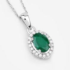 "14k Gold Emerald Pendant, Genuine Zambian Emerald Oval and Diamond 14k White Gold Pendant Necklace for Women, May Birthstone Gift for Her A luxe look for less! Sparkling with oval zambian emerald gemstone, this halo pendant necklace will have everyone fooled with its gorgeous gemstone lookalikes. Set in polished 14k white gold with fine finish with a total gemstone weight of 0.83 carats, this pendant necklace exudes a dreamy look. 14k gold emerald pendants are a perfect way to add a touch of co Oval Halo Setting Necklace For Formal Occasions, Oval Yellow Gold Necklace With Halo Setting, Oval Cubic Zirconia Necklaces In Halo Setting, Oval Cubic Zirconia Necklaces With Halo Setting, Oval Diamond For May Birthstone, Fine Jewelry Oval Necklace With Polished Finish, Oval May Birthstone Gemstone Necklace, Oval May Birthstone Jewelry With Polished Finish, Formal Oval Pendant Emerald Birthstone Necklace