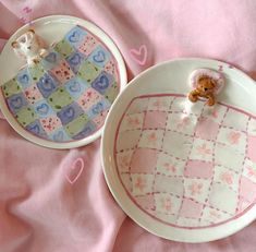 two plates with teddy bears on them sitting next to each other in the shape of hearts