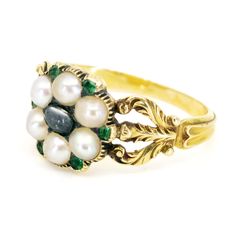 This lovely antique ring feature Moonstone decorated with Pearls accented with Emeralds crafted in 14ct. Design Era: Early Victorian (1837-1855). Size: 16.71 NL / 52.5 FR / 6¼ US / M UK Dimensions: H 0.4 X L 1 x W 1 cm. Weight in grams: 3,5. Condition: Very good condition - slightly used with small signs of wear. Resizing possible (contact seller for information). Registered Shipping or Local Pickup at our store (in case of Local Pickup; shipping cost if applicable will be refunded). Looking for Victorian Oval Pearl Ring With Gemstone, Victorian Moonstone Gemstone Ring For Wedding, Victorian Moonstone Cabochon Ring For Wedding, Victorian Yellow Gold Pearl Ring With Rose Cut Diamonds, Victorian Gold Pearl Ring With Gemstone, Antique Pearl Ring With Gemstone, Gold Victorian Pearl Ring With Gemstone, Victorian Oval Cabochon Pearl Ring, Antique Cabochon Emerald Wedding Ring