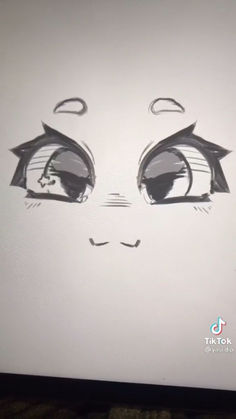 a drawing of a face with eyes drawn on the side of a computer monitor screen