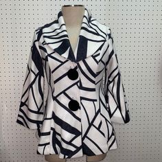 Elevate Your Fashion Game With This Stunning White And Black Print Jacket From Damee Inc. Featuring A Button-Up Closure And 3/4 Sleeves, This Mid-Length Jacket Is Perfect For Any Occasion, From Casual Outings To Formal Events. The Velvet Buttons And Single-Breasted Design Add A Touch Of Elegance To The Jacket, While The Lined Polyester Material Ensures Comfort And Durability. Chic Outerwear With Lapel Collar And Covered Buttons, Chic Outerwear With Covered Buttons And Lapel Collar, Collared Outerwear With Covered Buttons For Office, Chic Button-up Outerwear With Covered Buttons, Modern White Outerwear For Fall, Oversized White Buttoned Outerwear, Oversized White Outerwear With Buttons, Chic Outerwear With Covered Buttons For Office, Chic Outerwear With Covered Buttons