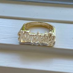 Medium Size Personalized Name Ring In Real 10K & 14K Gold *FLAT FACE * MADE IN USA (HAND MADE ITEM) Make the names of your family, friends and love ones into rings for their gift. It's great as an everyday necklace and makes an awesome gift! This Item is 100% customization especially for you. Item Description *Material: Real Gold *Type: *FLAT FACE* ( Like photo) with Heart Tail with Bit Work *Ring size: ring sizes between 1-11 (including half sizes) *Size of Ring : 20mm*8mm *Script Design *O Script Design, Flat Face, Like Photo, Name Ring, Name Rings, Gold Flats, Everyday Necklace, Small Containers, Ring Sizes