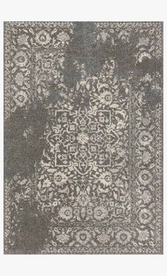 a gray and white rug with an intricate design