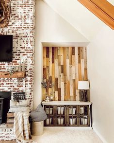 a living room filled with furniture and a flat screen tv mounted on a wall next to a fireplace