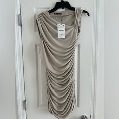 Nwt Zara Ruched Dress Beige Draped Dress For Spring, Beige Sleeveless Ruched Dress, Beige Ruched Sleeveless Dress, Beige Draped Midi Dress For Spring, Beige Ruched Draped Dress, Beige Draped Ruched Dress, Beige Ruched Sleeveless Mini Dress, Sleeveless Ruched Beige Mini Dress, Beige Draped Summer Dress