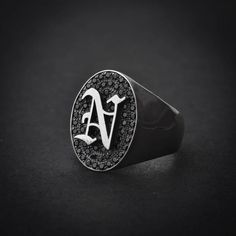 A handmade sterling silver 925 oval shape old english letter signet ring with black stones.Each ring is cleaned and polished with care.The weight of the ring may vary according to size.Aprrox weight: 9.40grTop measurements: Width - 14.5mm | Height - 19.3mmThe ring is made of sterling silver 925 and is water resistant.The ring is set with black zircons.This ring is available in more shapes!Oval> https://www.etsy.com/il-en/listing/579579043/oval-letter-signet-ring-initial-ringOctagon> https: Elegant Black Rings With Initials, Classic Black Round Initial Ring, Classic Black Signet Ring With Initials, Silver Initial Ring With Polished Finish, Black Engraved Ring With Initials For Anniversary, Black Initial Ring With Polished Finish As Gift, Elegant Engraved Black Initial Ring, Black Initials Jewelry For Anniversary, Luxury Oval Sterling Silver Initial Ring