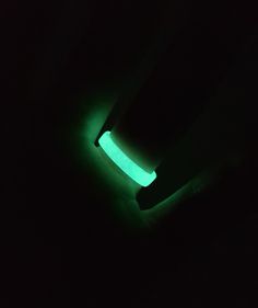 a green glow stick in the dark