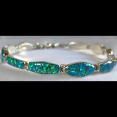 Nwt Handcrafted In The Usa. Sterling Silver Inlaid With The Finest Quality Gilson Lab Created Opal. This Multiple Shaped Bracelet Is Absolutely Stunning. It Is A Total Of 7 1/2 Inches In Length With A 3/4 Inch Extension That Varifies Length Anywhere From 6 3/4 To 7 1/2 Inches. All Offers Welcome!I To Make Someone’s Day. As A Jeweler,I Have Access To Fine Jewelry @Cost,... Lower Than Imaginable.Like To Be Sure It Goes For The Love Of The Piece(S) Of Jewelry. Elegant Turquoise Bracelet With Inlay, Elegant Turquoise Inlay Bracelet, Elegant Green Jewelry With Inlay, Elegant Formal Bracelets With Inlay, Formal Inlay Bracelet Jewelry, Elegant Inlay Jewelry, Opal Bracelet, Beautiful Clothes, Womens Jewelry Bracelets