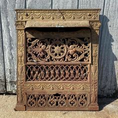 Antique Architectural Salvage Ornate Victorian Arts and Crafts Cast Iron Fireplace Surround With 3 Piece Grill Summer Cover. Circa late 1800s. It is in good condition with minor surface oxidation, minor surface wear appropriate to age, gold paint finish, and is missing some of the mounting screws for the grill components. Also has some damage and bending to the lower part of the sheet metal back (see photos for details). Measurements as follows: Height: 30 3/4 inches  Width: 26 inches Antique Architectural Salvage, Metal Fireplace, Iron Fireplace, Victorian Fireplace, Cast Iron Fireplace, Antique Fireplace, Fireplace Screens, Fireplace Surround, Aesthetic Movement