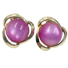 "Up For Sale, Beautiful Pair of Vintage Coro Gold Tone Moonglow Lucite Earrings.  Vintage 1950s 1960s. Condition: Very good, showing light wear.     Color: Gold Tone, Pink Maker/Label: Coro Material:  Gold Tone Metal, Lucite  Size: Approximately 1\" in diameter  For more of my Victorian through Midcentury  jewelry, click on this link:  https://www.etsy.com/shop/MyRecycledRunway?ref=profile_header§ion_id=30343785 This item will be packed carefully and shipped within 3-5 business days. Free shippi Lucite Earrings, Pink Retro, Lavender Pink, Profile Header, Mid Century Jewelry, Moon Glow, Earrings Vintage, Gold Tone Metal, Vintage 1950s