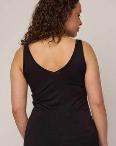 The women on our team can’t get enough of this tank. A layering piece that is comfortable, versatile, and has more length than other tanks you’re used to—made for tucking in or skimming the body for added coverage under other garments. Reversible front to back, allowing for either a scoop neck or v-neck option. Flatlock seams and just-right 1” width straps make it your most functional, everyday tank top. We recently updated this style (November 2023) to be a true slim layering tank. Chest, waist Seamless Construction Camisole For Layering, Tank Camisole For Layering With Seamless Construction, Seamless Tank Camisole For Layering, Stretch Tank Strap Tops For Loungewear, Bra Friendly Tank Top For Layering, Black Tank Top With Built-in Bra For Loungewear, Bra Friendly Camisole Top For Layering, Sporty Scoop Neck Tank Top For Layering, Bra-friendly Camisole Tops For Layering