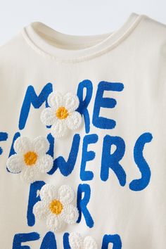 FLORAL PRINT TOP T-shirt Floral, Zara Summer T-shirt With Text Print, Trendy Blue T-shirt With Embroidered Graphics, Summer Short Sleeve T-shirt With Embroidered Text, Trendy White Zara T-shirt, Zara T-shirt With Letter Print For Spring, White Embroidered Graphic Tee, Zara Cotton Graphic Tee, Spring Graphic Print Tee