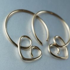 Simple lightweight heart hoops suitable for everyday wear and sleeping in. Hypoallergenic nickel free materials are used. These fit standard piercings and are sold as pairs. Metal options are 14k yellow gold-filled, 14k rose gold filled, sterling silver, argentium sterling and grey niobium. -rose or yellow gold options -standard common earwire thickness - 20 gauge -diameter about 1 inch -nickel free -rubber stoppers for the back of the earrings are included -quantity - 1 pair These earrings are Cute Gold Heart Earrings Nickel Free, Gold Hypoallergenic Open Heart Hoop Earrings, Cute Small Gold Hoop Earrings, Cute Gold Huggie Hoop Earrings, Gold Bar Earrings Studs, Earring Frame, Black Diamond Earrings Studs, Jewelry Frames, Black Diamond Earrings