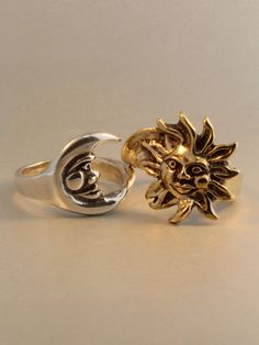 The Eclipse Ring is a striking two part ring set. The silver moon nestles into the golden rays of the bronze sun. The contrast of the two metals is striking and appropriately, the sun is cast in bronze and the moon is cast in sterling silver. We have many ring sizes immediately available. We will contact you to let you know if we have your chosen ring size in stock or when to expect shipment. Our bronze jewelry is antiqued lightly, and bronze will tarnish, or patina over time. To maintain the go Eclipse Ring, Art Deco Sun, Sun And Moon Rings, Sun Ring, Ring Moon, Puzzle Ring, Two Tone Ring, Celestial Ring, Gothic Ring