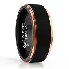 a black and rose gold wedding band with an inscription on it