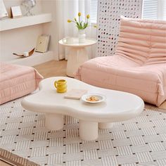 a living room with two chairs and a coffee table