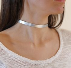 "Bridesmaid Necklace, silver Choker Necklace, Tattoo choker Necklace, Faux Leather Choker, Dainty Choker Necklace, Boho Chic Choker I LOVE this Faux Leather Silver choker necklac , this choker is a MUST have for your wardrobe , this necklace is perfect for any kind of weather time or type of women .We ladies love to keep it simple and trendy. Unless stated otherwise, the length of our chokers band is 11\"-12\" inches and includes a 3\" inches Silver/Gold Plated chain extender attached for extra Alternative Silver Choker Necklace, Everyday Minimalist Silver Choker, Adjustable Silver Metal Choker, Elegant Silver Nickel-free Choker, Nickel-free Silver Choker, Tattoo Choker Necklace, O Ring Choker, Necklace Tattoo, Black Leather Choker