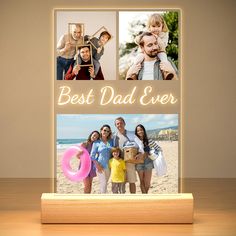 the best dad ever photo frame is displayed on a wooden stand with three photos and an inscription