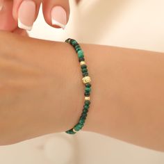 Natural | High Grade | USA | 3 Days Free Shipping | Morphora Official The Mondo Malahit Bracelet offers a powerful look with deep green tones of malahit stone. Discover this stylish bracelet now and add a natural energy to your style! Product Type : Women's Bracelet Stone Type : Malachite Stone Color : Green Stone Size : 3 mm Material : 925 Sterling Silver Material Color: Gold Plated Bracelet Size: 16 cm with Rubber Wrist Size: 5 to 9 inches (stretch cord) 30 Days Easy Return Free 2-4 Days Shipp Women Protection, Malachite Bracelet, Malachite Stone, Stylish Bracelet, Bracelet Gemstone, Bracelet For Men, Gold Plated Bracelets, Gemstone Bracelet, Bead Bracelet