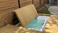 a hot tub sitting on top of a wooden deck