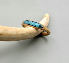 Super cute and durable, these are Oak bands with hand carved inlay channels.  I back painted the channel metallic blue before I set the turquoise; I like the combination!   The turquoise was crushed from some old beads I've had for years, so, the wood and inlay are both upcycled!   Finished and strengthened by cyanoacrylate adhesive then polished to high, smooth shine. Check the Add Personalization box to request different colored inlay channel, widths or anything else you may choose to better customize your ring. *Your ring will come in a microfiber bag that you can use to clean and buff as needed.   It is water resistant, and will hold up to frequent hand washing; Exercise caution with exposure to long periods of submersion, abrasives, or chemicals, as ring could become damaged over time Wooden Wedding Ring, Back Painting, Wooden Ring, Wooden Wedding, Wood Rings, Metallic Blue, Wooden Rings, Wooden Boxes, Wedding Engagement