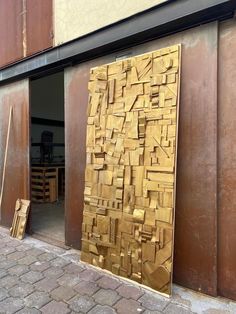 a large piece of wood sitting on the side of a building