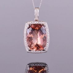 A gorgeous 39.82 carat morganite accented with 1.57 carats of white diamonds. All set in 18k white gold. Dimensions are 48.3mm x 27.5mm x 14mm Luxury White Gold Morganite Jewelry, Luxury Morganite Jewelry In White Gold, Exquisite Formal Morganite Jewelry, Luxury Morganite Gemstone Jewelry, Elegant Morganite Jewelry, Formal White Gold Morganite Jewelry, Elegant Morganite Gemstone Jewelry, Classic White Gold Morganite Jewelry, Morganite White Gold Jewelry With Halo Setting