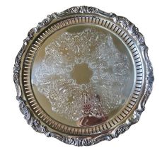 a silver plate with an ornate design on it