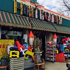 the front of a store with many items on display