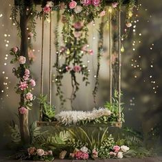 a swing with flowers and greenery hanging from it