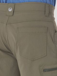 PERFORMANCE AND POCKET SPACE From exploring the outdoors to running errands around town, the men's Wrangler Authentics® comfort waist cargo short will keep you comfortable every step of the way. These performance shorts are crafted from a premium fabric blend with stretch, UPF 30 to shield you from the sun, and a moisture-wicking finish to keep you feeling dry. These cargo shorts for men come with a comfort flex waistband that adapts to every move you make, a relaxed fit for extra room, and a 10 Cargo Shorts For Men, Earth Green, Western Shop, Wrangler Shorts, Workwear Jeans, Cargo Short, Mens Workwear, Work Shorts, Outdoor Pants