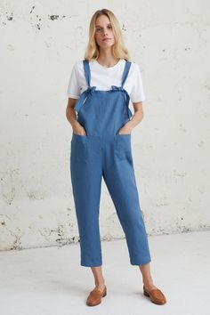 Casual Linen Jumpsuit, Blue Strap Jumpsuit, Linen Dungarees This Casual Linen Jumpsuit is minimal, handmade crafted from pure, soft-washed linen. With its slightly tapered silhouette, adjustable fit, and convenient side pocket, this versatile jumpsuit effortlessly combines comfort and style. Perfect for a sporty chic look or a casual ensemble, it pairs well with sneakers or heels. Whether attending a music festival or simply enjoying a day out, this long linen jumpsuit is a must-have. Give the gift of unique fashion to your loved ones who value both style and comfort. Embrace minimalist elegance with our perfect summer linen romper. D E S C R I P T I O N * Loose fit style  * Sleeveless * Two front pockets * Tapered / slim leg * Straight cut * Sizes: XS - XXL * 100% linen * European soft an Blue Denim Bib Front Jumpsuit With Pockets, Blue Bib Front Denim Jumpsuit With Pockets, Blue Denim Jumpsuit With Bib Front And Pockets, Blue Sleeveless Shortalls For Summer, Sleeveless Blue Shortalls For Summer, Blue Shortalls With Pockets, Blue Bib Front Shortalls For Summer, Summer Workwear Denim Jumpsuit With Bib Front, Blue Overall Jumpsuit For Work