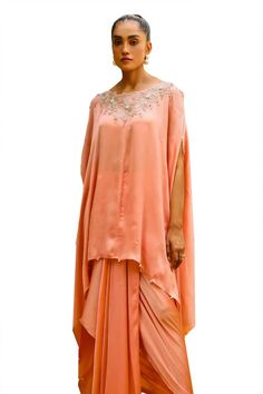 Peach short kaftan featuring zardozi embroidery with crystals and cut dana detailing on the sleeve. Paired with a armhole paired with signature pickup skirt - Aza Fashions Embellished Silk Palazzo Set With Traditional Drape, Festival Georgette Kaftan With Dabka Detailing, Traditional Peach Dress With Drape, Embellished Georgette Kaftan With Traditional Drape, Traditional Hand Embellished Draped Dress, Designer Peach Dress With Traditional Drape, Elegant Embellished Peach Sets, Designer Georgette Kaftan With Cape Sleeves, Elegant Peach Embellished Sets