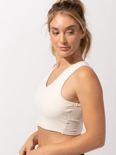 The cutest crop around! The Maliha Twist-Back Crop Top sports a fashionable twist-back detail, while working as a sports bra & active top all in one. This Bra does not have built in pads. Sporty Beige Workout Tops, Beige Athleisure Sports Bra For Workout, Cropped Top With Built-in Bra For Light Exercise, Beige Sporty Top For Sportswear, Sporty Beige Activewear With Built-in Bra, Beige Sporty Activewear With Built-in Bra, Light Exercise Crop Top With Medium Bust Support, Versatile Activewear Crop Top With Built-in Bra, Sporty Beige Yoga Tops