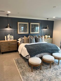 a large bed sitting inside of a bedroom on top of a carpeted floor next to two lamps