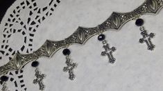 Victorian Gothic metal choker with hollow crosses and black crystal beads, ornate metal necklace, Victorian jewelry, Gothic jewelry A beautifully ornate gothic silver metal choker with Victorian hollow cross charms and black faceted crystal beads. It measures approx. 11 inches in length and has lobster clasp fastening and an extension chain, so that it can be adjusted to fit the neck. The choker is made up of 7 silver toned metal ancient style sections that have intricate detailing. A marvelous Gothic Silver Metal Body Jewelry, Silver Gothic Metal Body Jewelry, Gothic Silver Jewelry With Black Beads, Silver Gothic Body Jewelry, Gothic Gold Cross Pendant Jewelry, Gothic Black Nickel-free Body Jewelry, Black Gothic Body Jewelry Nickel Free, Black Nickel-free Gothic Body Jewelry, Gothic Metal Jewelry With Black Beads