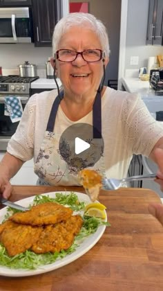 an older woman is eating some food on a plate