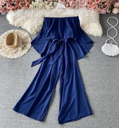 Stylish strapless irregular jumpsuitFabric: blendedColor: bugrundy, blue, pink, white, khaki, blackSize(cm): free sizelength 114 bust 60-94 waist 58-94 One Shoulder Jumpsuit For Summer, Trendy Blue Strapless Jumpsuits And Rompers, Chic Solid Bandeau Jumpsuits And Rompers, Strapless Bandeau Jumpsuit For Summer, Summer Strapless Bandeau Jumpsuit, Blue Strapless Wide Leg Jumpsuit For Summer, Chic Off-shoulder Blue Jumpsuit, Chic One-shoulder Jumpsuit In Solid Color, Cute Jumpsuits