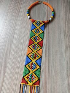 this necklace is 100% handcrafted using orange and green colours best for African themed events, wedding and traditional event's best gifts for loved ones measurements (round...18"long) (pendant..18" long) we ship via DHL express Beaded Necklace Pattern, African Necklaces, African Beaded Necklace, Beaded Tie, Necklaces Long, Green Colours, Necklace African, African Necklace, Themed Events