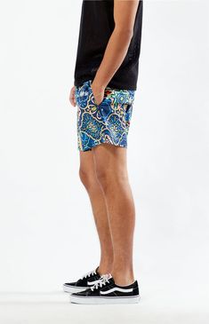 Add some colorful style to your weekend with the Modelo 5" Swim Trunks. Featuring an elastic stretch waistline and a festive pattern throughout, these swim shorts are perfect for adding flair to your poolside look.


	Elastic stretch waistline
	Side pockets
	Standard fit
	Single back pocket with drainage hole
	Mesh lining
	Custom pattern
	5" Inseam
	15" Outseam
	Model is wearing size medium
	Model Measurements: 6’2” Height, 29.5” Waist, 32” Inseam Blue Short-length Swimwear For Poolside, Blue Swimwear With Built-in Shorts For Vacation, Multicolor Swimwear With Built-in Shorts For Vacation, Beachy Blue Shorts, Stretch Beachwear Shorts For Beach Party, Blue Tropical Swim Trunks, Blue Beachy Swim Shorts, Summer Short Length Swim Trunks For Pool, Blue Beachy Shorts For Swimming