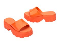 An edgy take on your traditional platform, the Ella Slide brings inspiration from the fisherman-style sandal designed for those who embrace their unique style. With a treaded heel, wide strap, and EVA insole, comfort is top of mind, but being fashionable is always number one. Chunky Platform Sport Sandals For Summer Beach, Modern Platform Clogs For Summer, Trendy Platform Clogs, Modern Open Toe Sandals With Thick Bottom, Modern Chunky Platform Slides For Summer, Modern Summer Platform Clogs, Modern Wedge Sandals With Rubber Sole For Summer, Modern Summer Platform Slippers With Rubber Sole, Summer Open Toe Clogs With Textured Sole