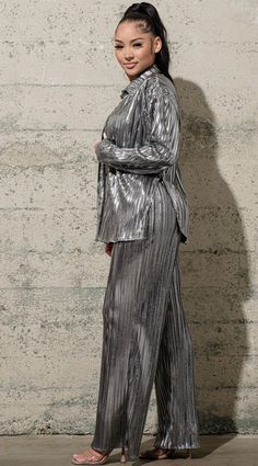 Show up to the holiday party slaying in this three piece pleated set. The long sleeve top and pants have a loose fit, and the bralette is lightly padded. A definite great holiday look❣️. 95% Polyester 5% Spandex Silver Outfits For Women, Gray Jumpsuit Outfit, Jungle Disco, Metallic Suit, True Winter Palette, Pleated Set, Stylish Winter Coats, Season Outfits, Winter Palette