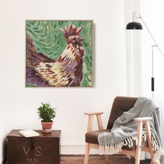 a painting on the wall next to a chair and potted plant